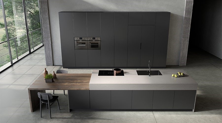 Industrial minimalist kitchen cabinets with dark grey tall cabinetry and integrated island dining table