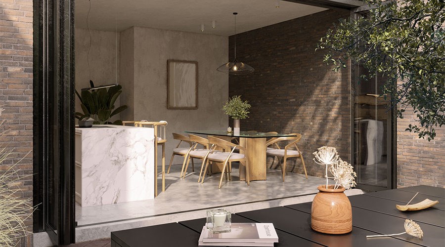 Courtyard connected open kitchen with island and garden-facing living space