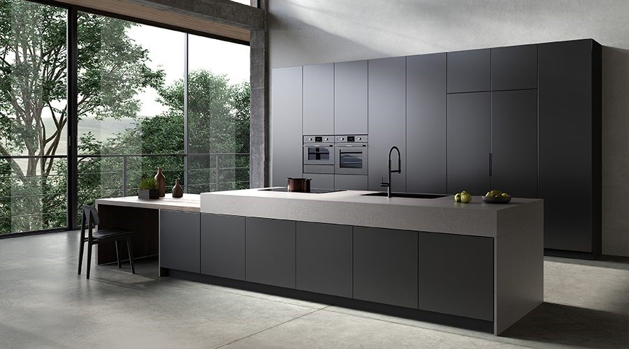 Sintered stone island with solid wood dining extension in an industrial minimalist kitchen